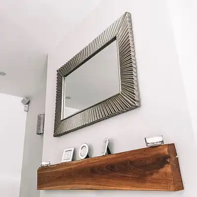 mirror over floating shelf